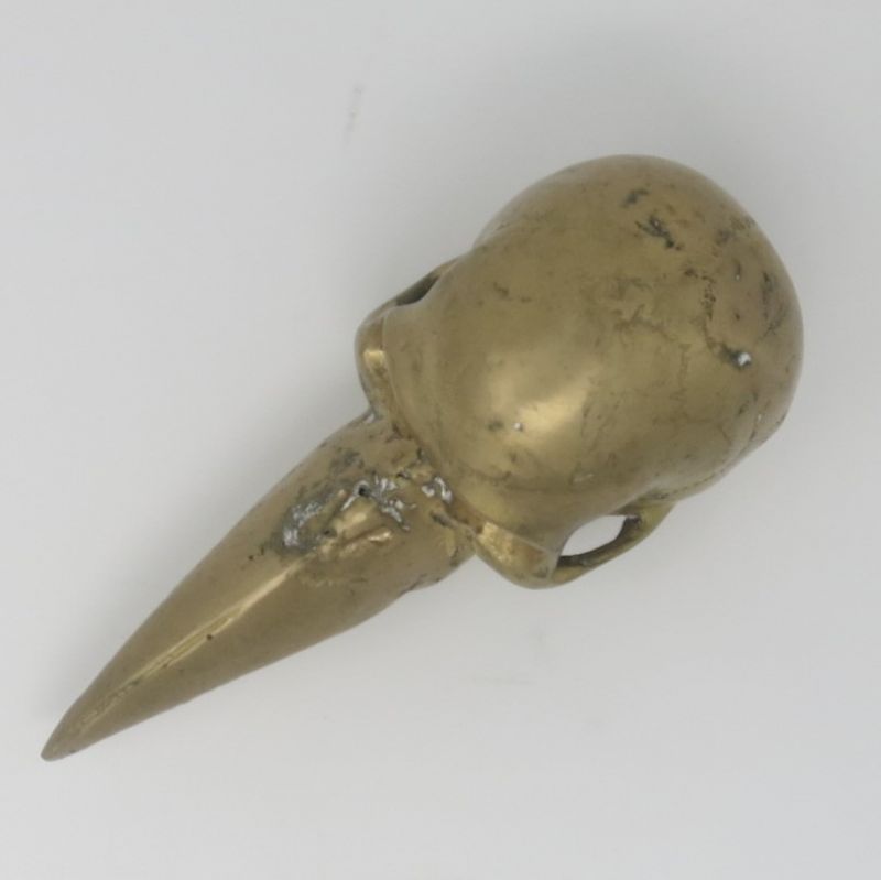 BRONZE SKULL WITH BEAM